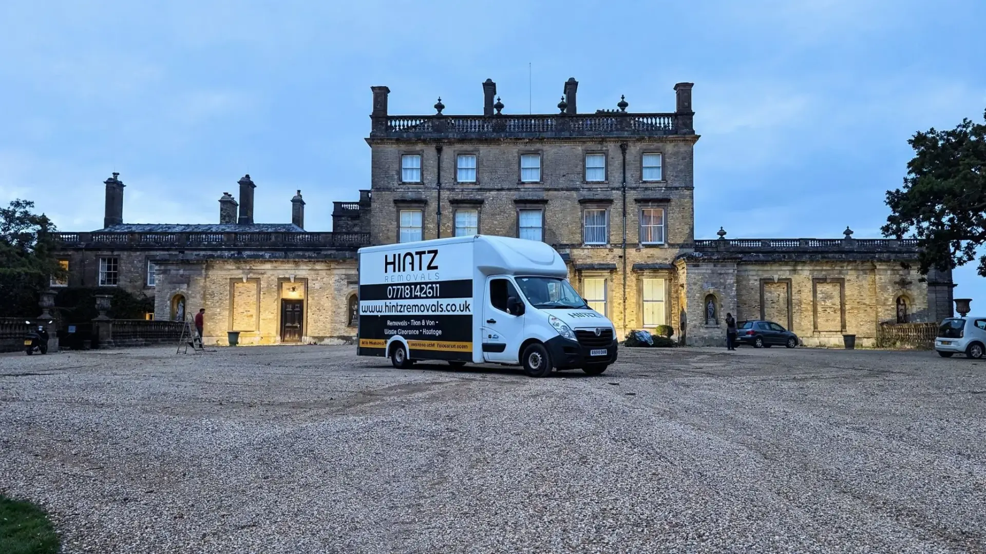 Hintz Removals team carrying furniture from a Bournemouth home